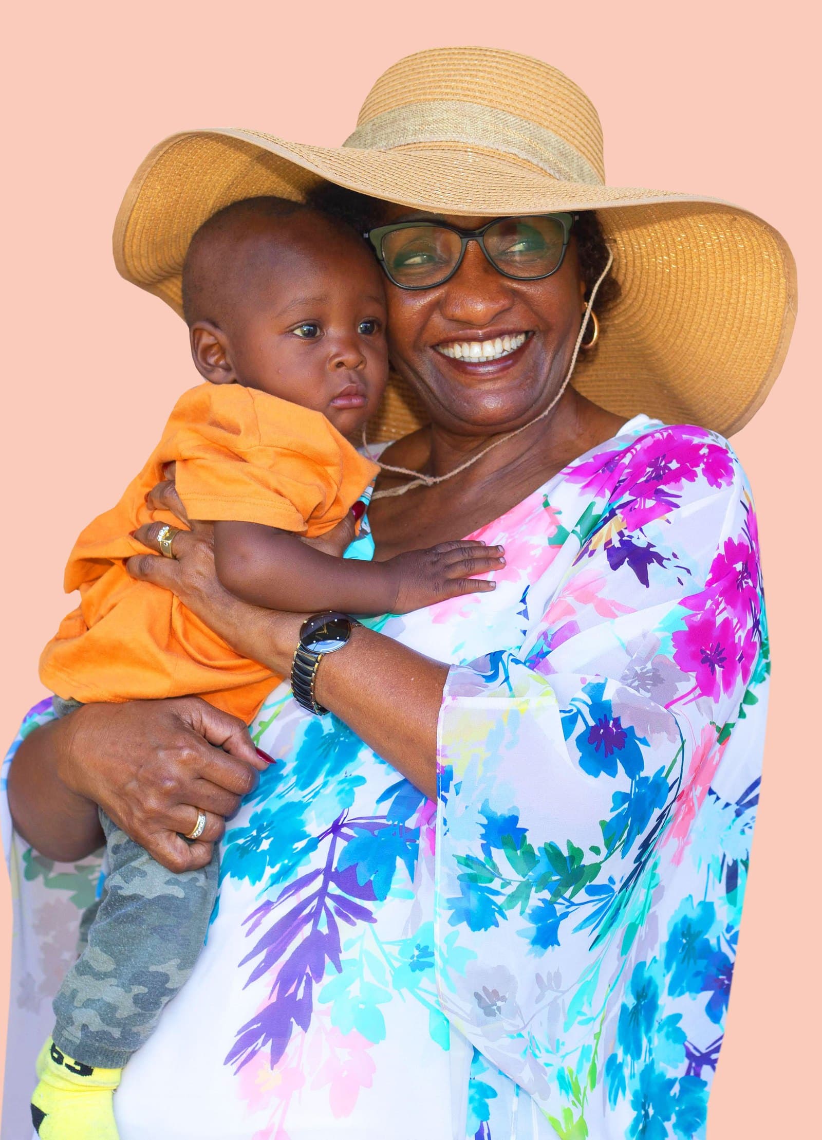 Lucy Yinda, HSC — Founder of Wema Centre Trust, holding a child