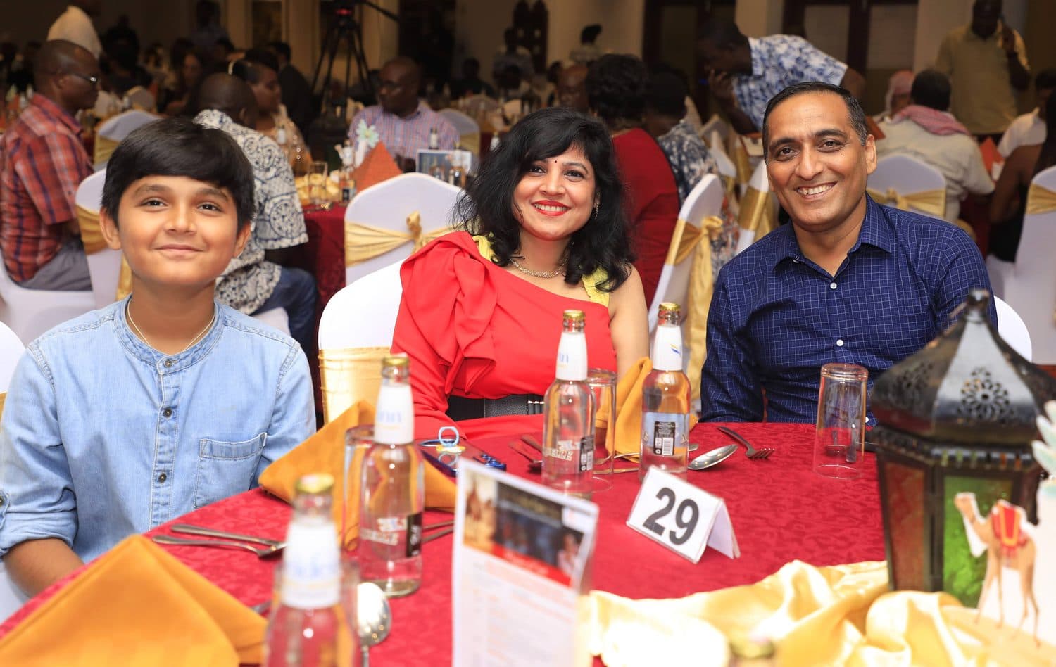 Guests enjoying dinner at a decorated gala table