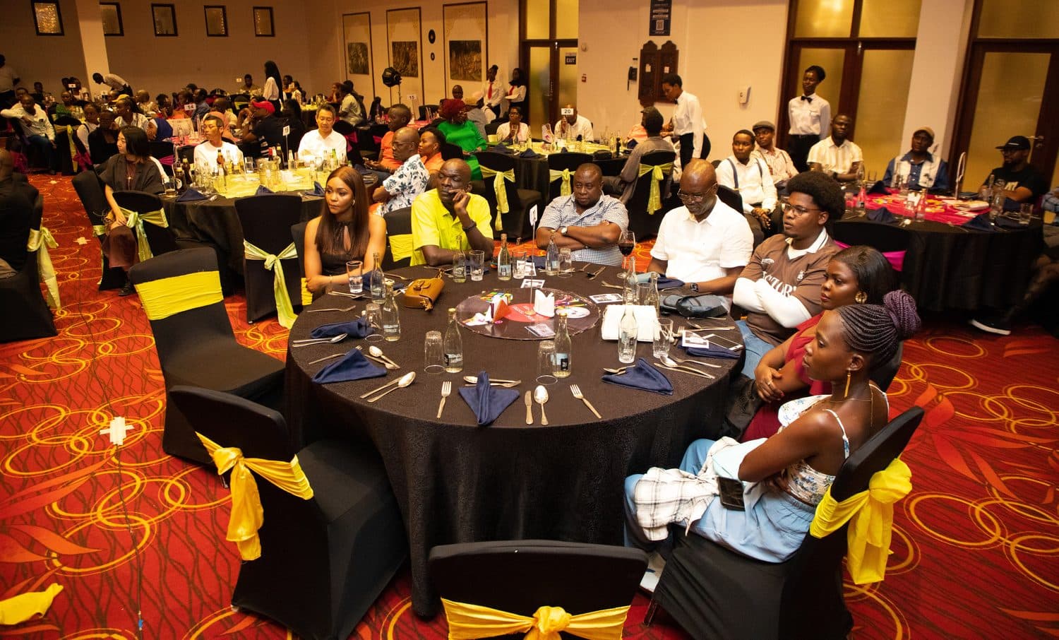 Guests seated at a decorated dinner table
